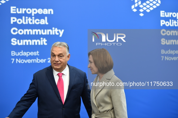 Maia Sandu, President of Moldova, is greeted by Viktor Orban, Hungarian Prime Minister, before the 5th European Political Community Summit i...