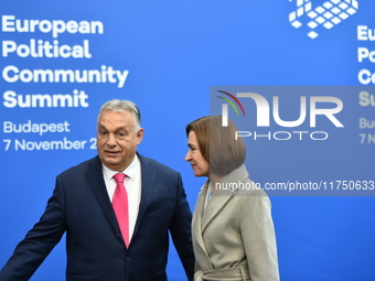 Maia Sandu, President of Moldova, is greeted by Viktor Orban, Hungarian Prime Minister, before the 5th European Political Community Summit i...