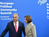 Maia Sandu, President of Moldova, is greeted by Viktor Orban, Hungarian Prime Minister, before the 5th European Political Community Summit i...