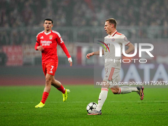 Joshua Kimmich of Bayern Munich  controls the ball during the Champions League Round 4 match between Bayern Munich v Benfica at the Allianz...