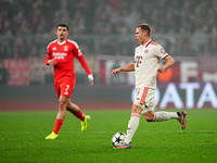 Joshua Kimmich of Bayern Munich  controls the ball during the Champions League Round 4 match between Bayern Munich v Benfica at the Allianz...