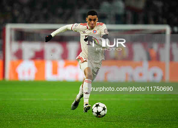 Jamal Musiala of Bayern Munich  controls the ball during the Champions League Round 4 match between Bayern Munich v Benfica at the Allianz a...