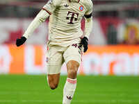 Jamal Musiala of Bayern Munich  controls the ball during the Champions League Round 4 match between Bayern Munich v Benfica at the Allianz a...