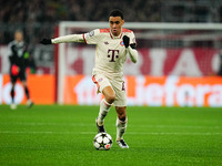 Jamal Musiala of Bayern Munich  controls the ball during the Champions League Round 4 match between Bayern Munich v Benfica at the Allianz a...