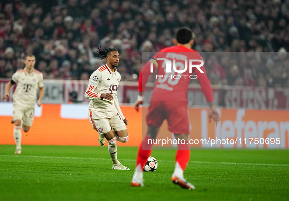 Michael Olise of Bayern Munich  controls the ball during the Champions League Round 4 match between Bayern Munich v Benfica at the Allianz a...