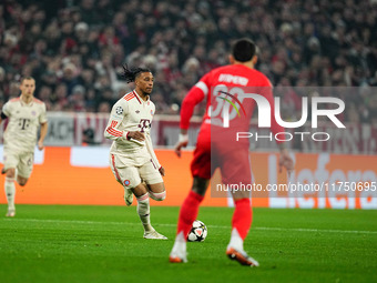 Michael Olise of Bayern Munich  controls the ball during the Champions League Round 4 match between Bayern Munich v Benfica at the Allianz a...