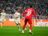 Michael Olise of Bayern Munich  controls the ball during the Champions League Round 4 match between Bayern Munich v Benfica at the Allianz a...