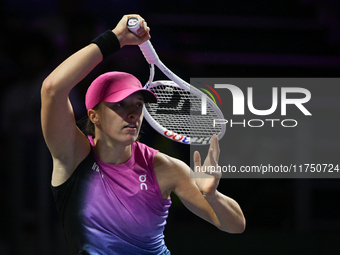 RIYADH, SAUDI ARABIA - NOVEMBER 07: Iga Swiatek of Poland during her match against Daria Kasatkina, on Day 6 of the 2024 WTA Finals, part of...