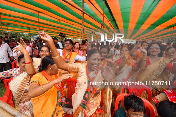 Supporters of the Bharatiya Janata Party (BJP) participate in an election campaign rally in support of BJP candidate Diplu Ranjan Sarmah fro...