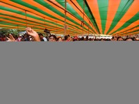 Supporters of the Bharatiya Janata Party (BJP) participate in an election campaign rally in support of BJP candidate Diplu Ranjan Sarmah fro...