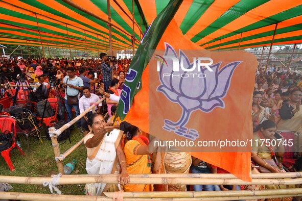 Supporters of the Bharatiya Janata Party (BJP) participate in an election campaign rally in support of BJP candidate Diplu Ranjan Sarmah fro...