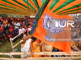 Supporters of the Bharatiya Janata Party (BJP) participate in an election campaign rally in support of BJP candidate Diplu Ranjan Sarmah fro...