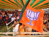 Supporters of the Bharatiya Janata Party (BJP) participate in an election campaign rally in support of BJP candidate Diplu Ranjan Sarmah fro...