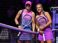 RIYADH, SAUDI ARABIA - NOVEMBER 07: Iga Swiatek (L) of Poland pose for a photo with Daria Kasatkina (R), on Day 6 of the 2024 WTA Finals, pa...