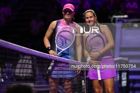 RIYADH, SAUDI ARABIA - NOVEMBER 07: Iga Swiatek (L) of Poland pose for a photo with Daria Kasatkina (R), on Day 6 of the 2024 WTA Finals, pa...