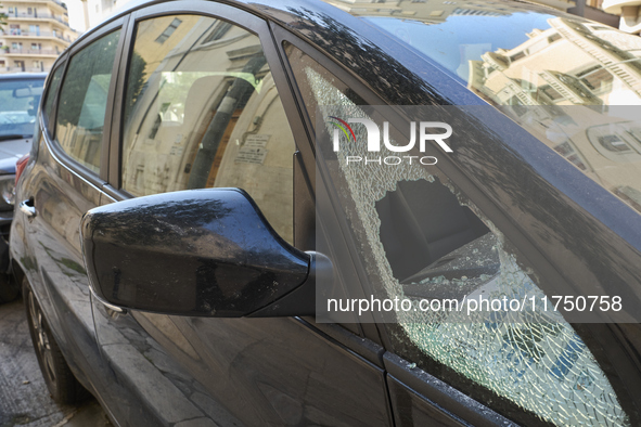 A close-up shot of a car with a shattered side window results from an attempted theft in Bari, Italy, on November 6, 2024. This image highli...