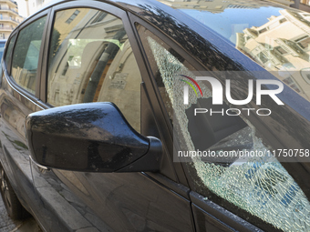 A close-up shot of a car with a shattered side window results from an attempted theft in Bari, Italy, on November 6, 2024. This image highli...