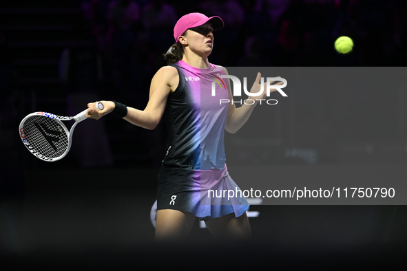 RIYADH, SAUDI ARABIA - NOVEMBER 07: Iga Swiatek of Poland during her match against Daria Kasatkina, on Day 6 of the 2024 WTA Finals, part of...