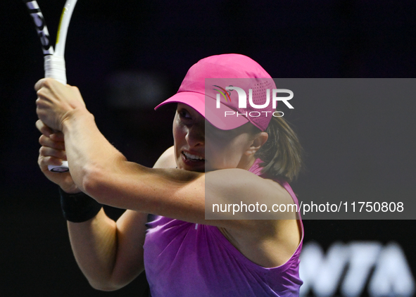 RIYADH, SAUDI ARABIA - NOVEMBER 07: Iga Swiatek of Poland during her match against Daria Kasatkina, on Day 6 of the 2024 WTA Finals, part of...