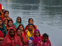 Devotees offer prayers to the sun god at a riverside 70 kilometers outside of Kolkata, India, on November 7, 2024, during the Chhath Puja fe...