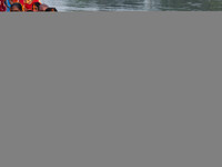 Devotees offer prayers to the sun god at a riverside 70 kilometers outside of Kolkata, India, on November 7, 2024, during the Chhath Puja fe...