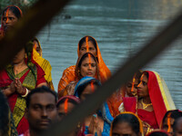 Devotees offer prayers to the sun god at a riverside 70 kilometers outside of Kolkata, India, on November 7, 2024, during the Chhath Puja fe...