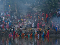 Devotees offer prayers to the sun god at a riverside 70 kilometers outside of Kolkata, India, on November 7, 2024, during the Chhath Puja fe...