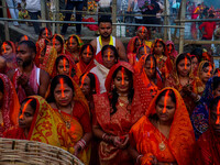 Devotees offer prayers to the sun god at a riverside 70 kilometers outside of Kolkata, India, on November 7, 2024, during the Chhath Puja fe...