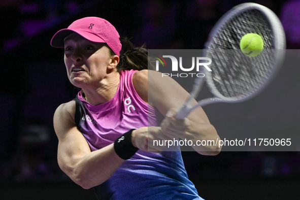 RIYADH, SAUDI ARABIA - NOVEMBER 07: Iga Swiatek of Poland during her match against Daria Kasatkina, on Day 6 of the 2024 WTA Finals, part of...