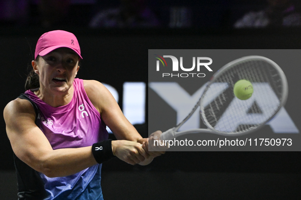 RIYADH, SAUDI ARABIA - NOVEMBER 07: Iga Swiatek of Poland during her match against Daria Kasatkina, on Day 6 of the 2024 WTA Finals, part of...