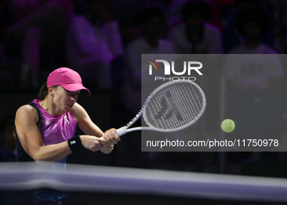 RIYADH, SAUDI ARABIA - NOVEMBER 07: Iga Swiatek of Poland during her match against Daria Kasatkina, on Day 6 of the 2024 WTA Finals, part of...