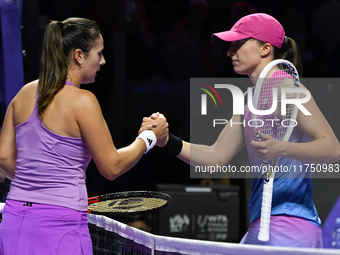 RIYADH, SAUDI ARABIA - NOVEMBER 07: Daria Kasatkina congratulates Iga Swiatek of Poland after their match, on Day 6 of the 2024 WTA Finals,...