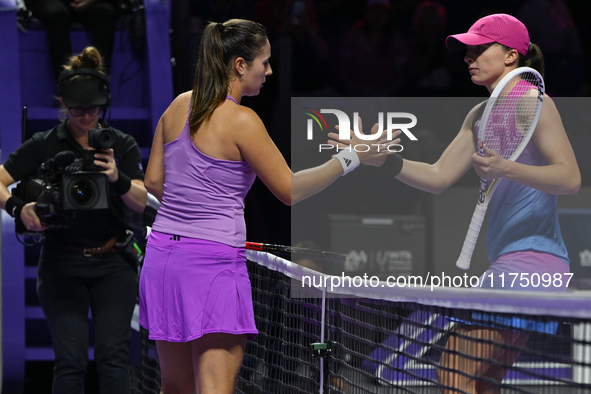 RIYADH, SAUDI ARABIA - NOVEMBER 07: Daria Kasatkina congratulates Iga Swiatek of Poland after their match, on Day 6 of the 2024 WTA Finals,...