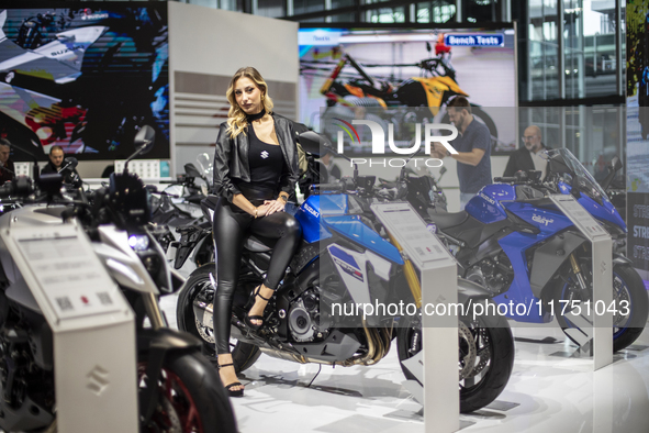 A model poses on a Suzuki GSX-S 1000 at the 110th International Motorcycle and Accessories Exhibition 2024 at Fiera Milano Rho in Milan, Ita...