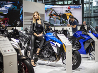 A model poses on a Suzuki GSX-S 1000 at the 110th International Motorcycle and Accessories Exhibition 2024 at Fiera Milano Rho in Milan, Ita...