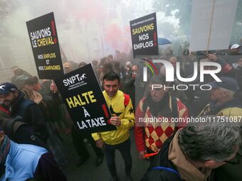 Protesters hold a placard that reads ''Stop taxing!'', ''No to taxation of horse-race betting!'' and ''Let's save the horse! our jobs and ou...