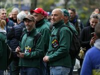 Protesters wearing green jackets from the Chantilly Hippodrome that read ''Stop the tax'' take part in a demonstration organized by horse ra...