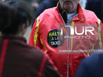 A protester wears red jockeys' silks reading ''Stop the tax'' and takes part in a demonstration organized by horse racing associations and p...