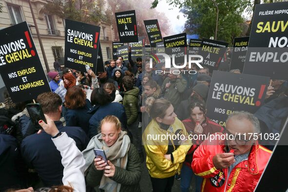 Protesters hold a placard that reads ''Stop taxing!'', ''No to taxation of horse-race betting!'' and ''Let's save the horse! our jobs and ou...