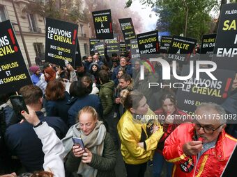 Protesters hold a placard that reads ''Stop taxing!'', ''No to taxation of horse-race betting!'' and ''Let's save the horse! our jobs and ou...