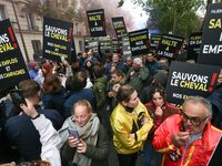 Protesters hold a placard that reads ''Stop taxing!'', ''No to taxation of horse-race betting!'' and ''Let's save the horse! our jobs and ou...