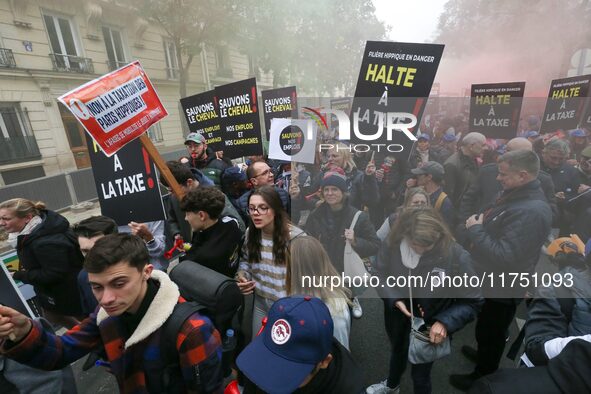 Protesters hold a placard that reads ''Stop taxing!'', ''No to taxation of horse-race betting!'' and ''Let's save the horse! our jobs and ou...