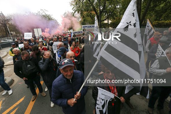 Protesters hold a placard that reads ''Stop taxing!'', ''No to taxation of horse-race betting!'' and ''Let's save the horse! our jobs and ou...