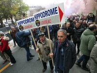 Protesters from Brittany hold a placard that reads ''Hippodrome Loudeac'' as they participate in a demonstration organized by horse racing a...