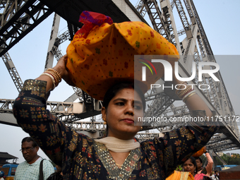 Hindu women devotees arrive at Ganga Ghat during the Hindu festival Chhath in Kolkata, India, on November 7, 2024. The 'Chhath' festival is...