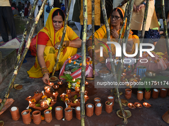 Hindu women devotees perform rituals during the Hindu festival Chhath in Kolkata, India, on November 7, 2024. The 'Chhath' festival is mostl...