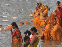 Hindu women devotees perform rituals in a water body in the river Ganga during the Hindu festival Chhath in Kolkata, India, on November 7, 2...