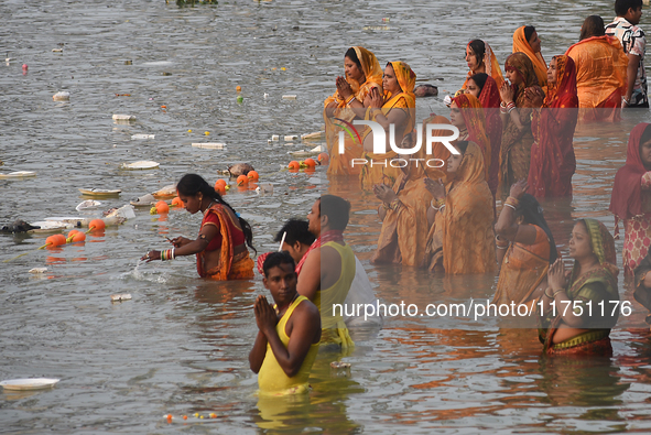 Hindu women devotees perform rituals in a water body in the river Ganga during the Hindu festival Chhath in Kolkata, India, on November 7, 2...