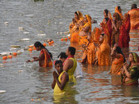 Hindu women devotees perform rituals in a water body in the river Ganga during the Hindu festival Chhath in Kolkata, India, on November 7, 2...