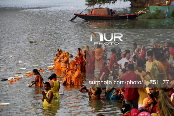 Hindu women devotees perform rituals in a water body in the river Ganga during the Hindu festival Chhath in Kolkata, India, on November 7, 2...